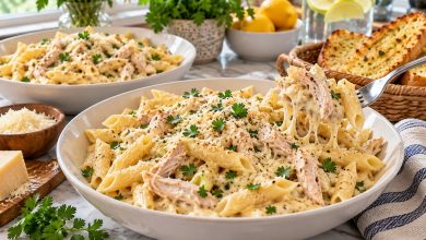 Crockpot creamy chicken pasta with penne, Parmesan and parsley in a bowl