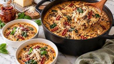 Creamy marry me chicken wild rice soup with sun-dried tomatoes and spinach