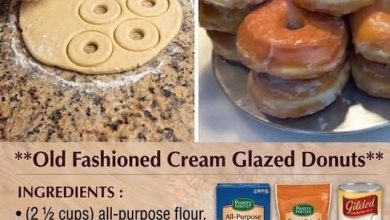 Stack of old-fashioned glazed donuts on a metal tray
