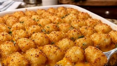 Old-fashioned tater tot casserole with crispy tots, melted cheddar, and beef in a baking dish