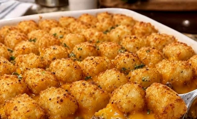 Old-fashioned tater tot casserole with crispy tots, melted cheddar, and beef in a baking dish