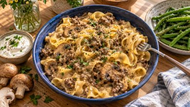 Ground beef stroganoff with egg noodles and mushrooms in a blue bowl