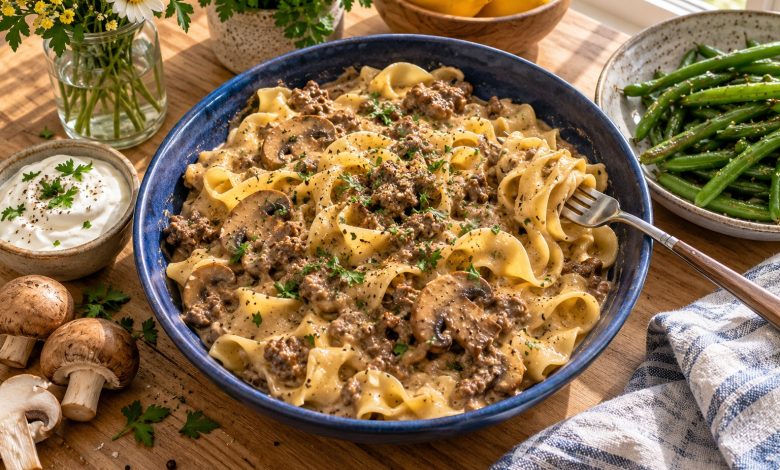 Ground beef stroganoff with egg noodles and mushrooms in a blue bowl