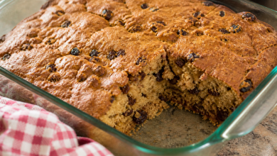 Old-Fashioned War-Time Cake with raisins cut into squares in a glass baking dish